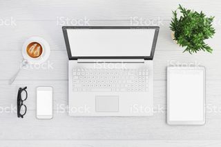 Blank laptop screen with phone and tablet