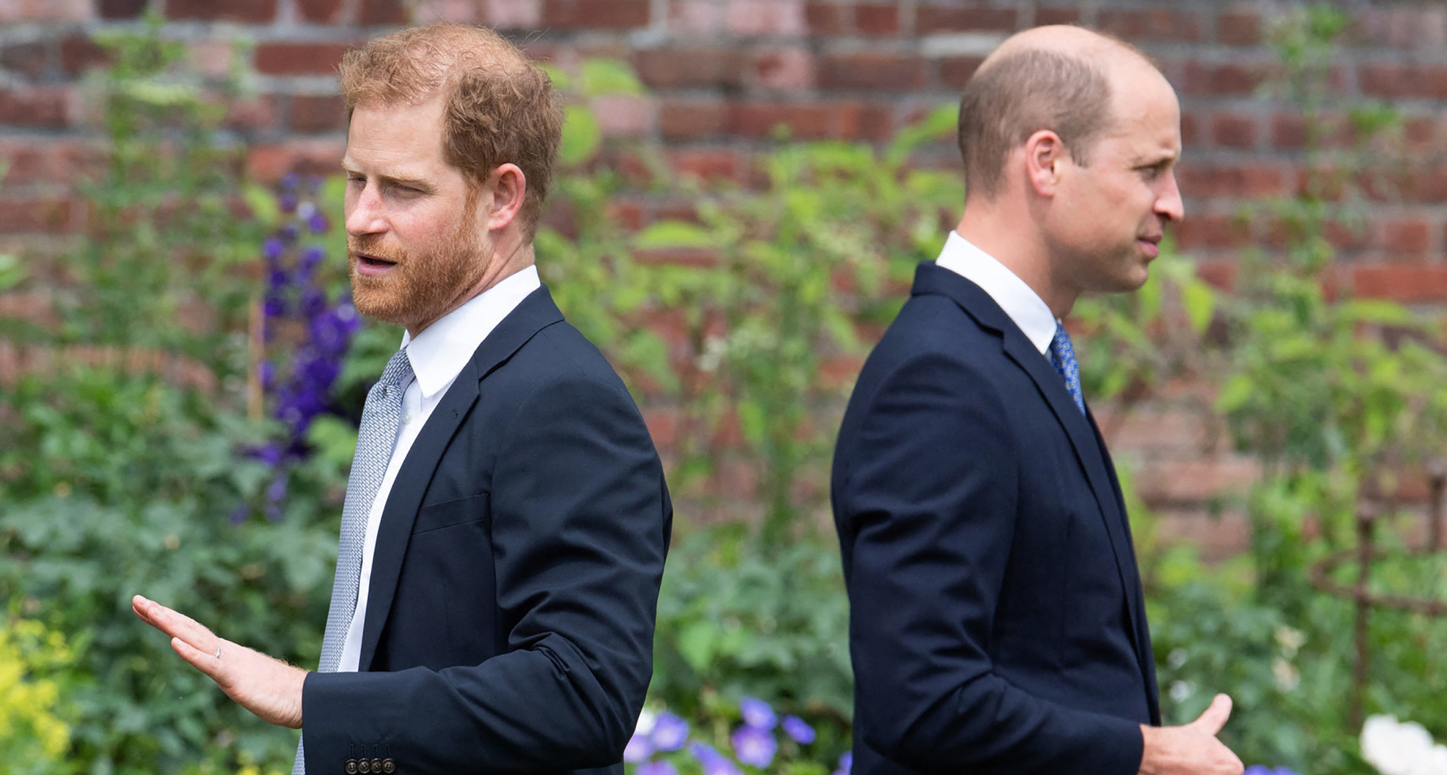Prince Harry and Prince William with their backs to each other