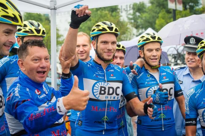 Pawel Bernas celebrates the stage with his BDC Marcpol team