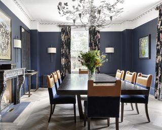 Dining room curtain ideas with dark floral patterned curtains in a dark blue room