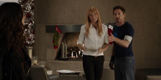 Iron Man 3 Tony and Pepper try to talk to Maya in front of the fireplace