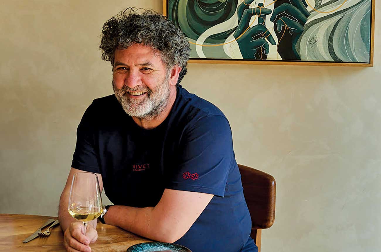 Isa Bal MS with glass of white wine