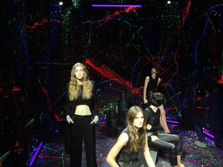 Models in front of a colorful backdrop
