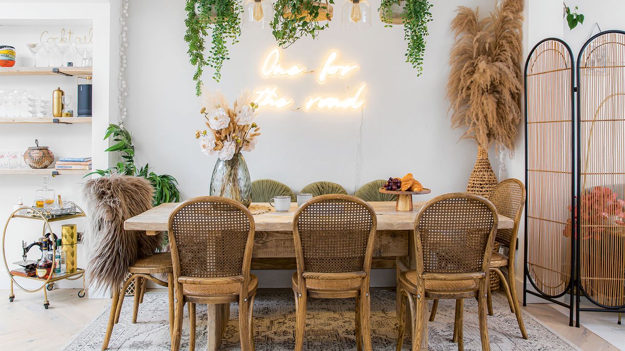 dining area with wooden dining table and woven chairs