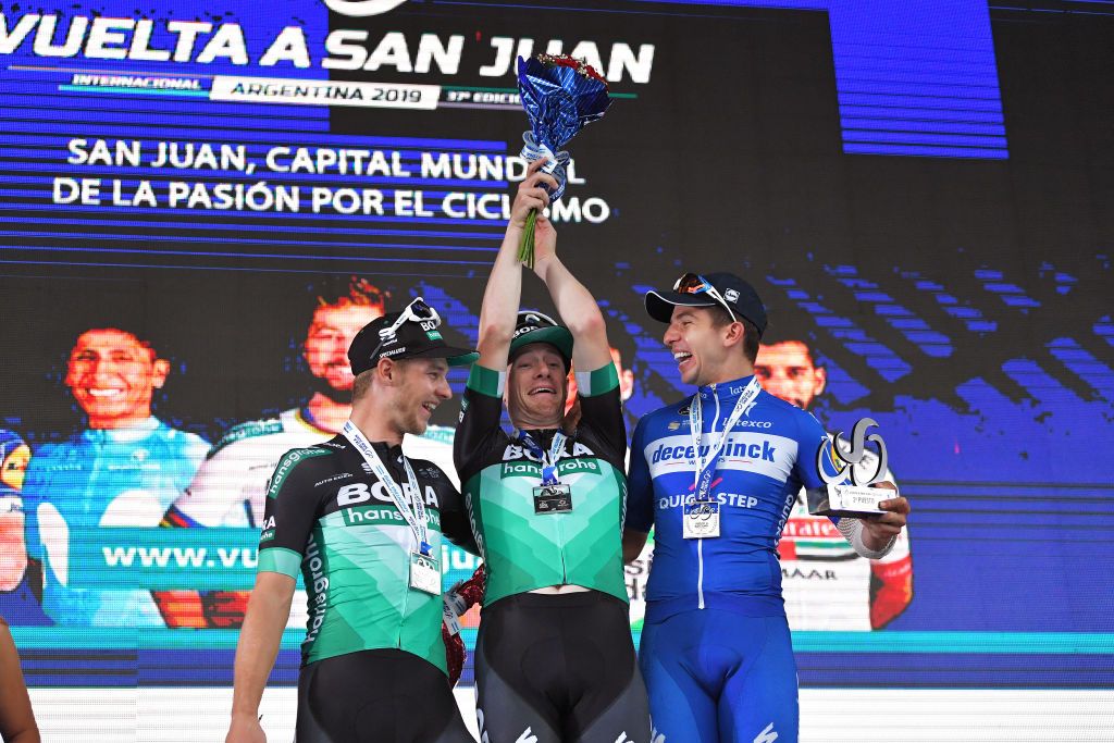 Sam Bennett has a little fun on the podium after winning the final stage