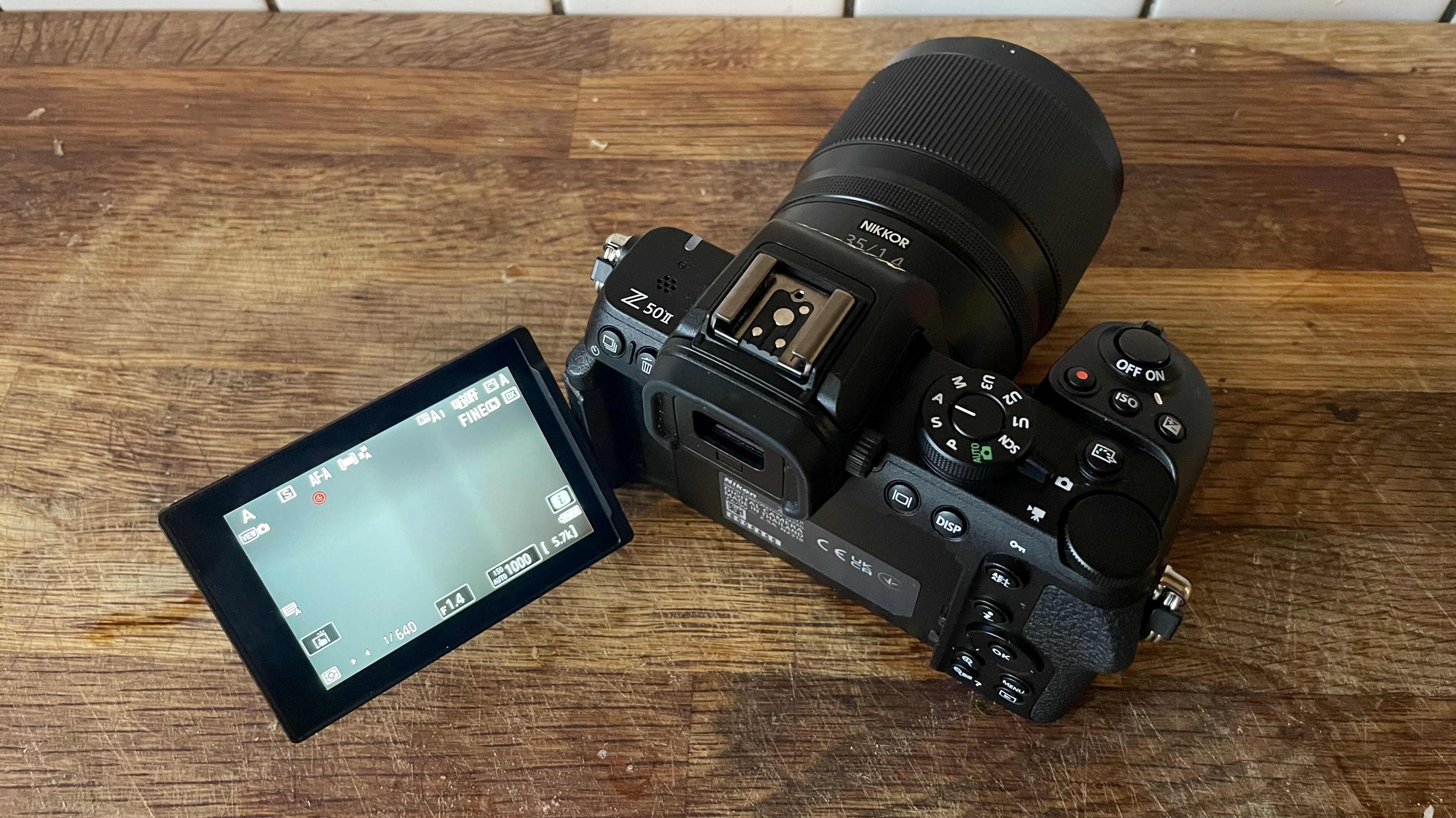 Nikon Z50 II mirrorless camera on a wooden tabletop