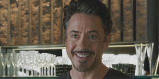 Tony Stark (Robert Downey Jr.) smiles.