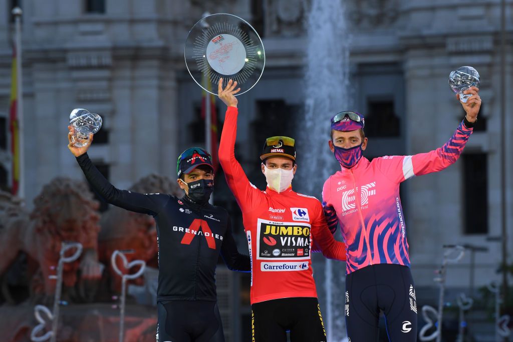 MADRID SPAIN NOVEMBER 08 Podium Richard Carapaz of Ecuador and Team INEOS Grenadiers Primoz Roglic of Slovenia and Team Jumbo Visma Red Leader Jersey Hugh Carthy of The United Kingdom and Team EF Pro Cycling Celebration Trophy Mask Covid safety measures Madrid Town Hall Plaza Cibeles Madrid City during the 75th Tour of Spain 2020 Stage 18 a 1396km stage from Hipdromo de la Zarzuela to Madrid lavuelta LaVuelta20 La Vuelta on November 08 2020 in Madrid Spain Photo by David RamosGetty Images