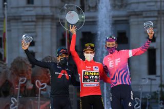 MADRID SPAIN NOVEMBER 08 Podium Richard Carapaz of Ecuador and Team INEOS Grenadiers Primoz Roglic of Slovenia and Team Jumbo Visma Red Leader Jersey Hugh Carthy of The United Kingdom and Team EF Pro Cycling Celebration Trophy Mask Covid safety measures Madrid Town Hall Plaza Cibeles Madrid City during the 75th Tour of Spain 2020 Stage 18 a 1396km stage from Hipdromo de la Zarzuela to Madrid lavuelta LaVuelta20 La Vuelta on November 08 2020 in Madrid Spain Photo by David RamosGetty Images