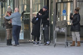 Former Internal Revenue Service workers leave their office after being laid off in downtown Denver, Colorado on Thursday, February 20, 2025. The IRS began laying off roughly 6,000 employees in the middle of tax season as the Trump administration via the Department of Government Efficiency (DOGE) works to downsize the federal workforce.