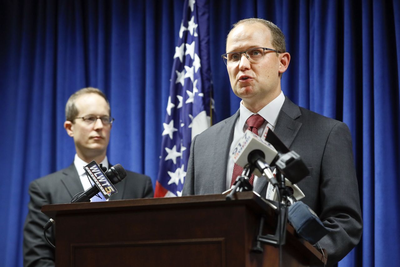 Herb Stapleton, right, speaks alongside U.S. Attorney Benjamin C. Glassman.