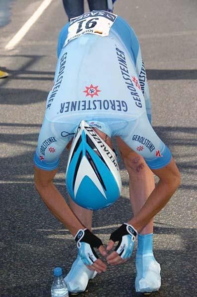 Stefan Schumacher (Gerolsteiner) stretches before the start.