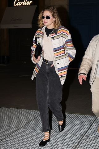 Gigi Hadid wearing a striped jacket in Paris.