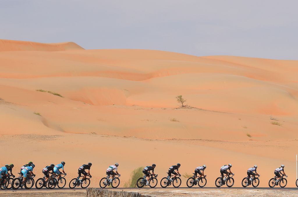 The peloton rides through the desert on stage 1