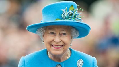 Queen Elizabeth II tours Queen Mother Square on October 27, 2016 in Poundbury, Dorset