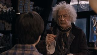 Ollivander showing Harry Harry Potter a wand in Harry Potter and the Sorcerer's Stone.