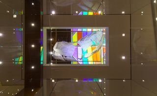 Multicoloured in-situ installation shares main billing with the exhibition and works with the space’s glass roof