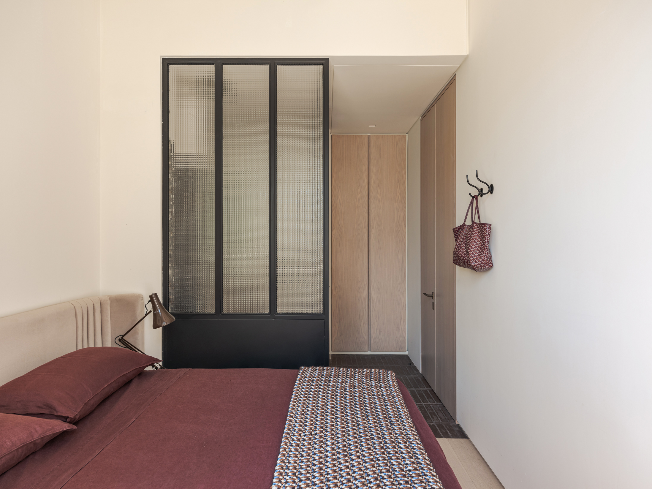 Bedrooms are modest, tucked away in the private ground floor