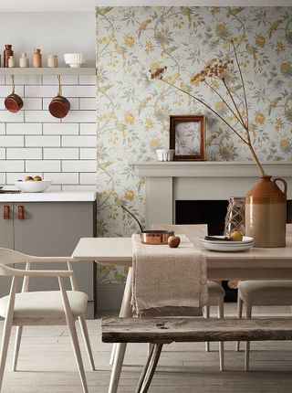 Floral wallpaper in an open plan kitchen with metro tiling contrast