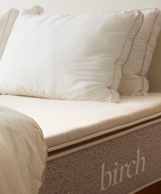 Pillows and a duvet on the Birch Plush Organic Mattress Topper.