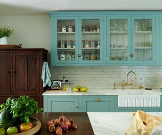 pale blue kitchen with white countertops