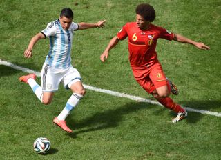 Argentina midfielder Enzo Perez competes for the ball with Belgium's Axel Witsel at the 2014 World Cup.