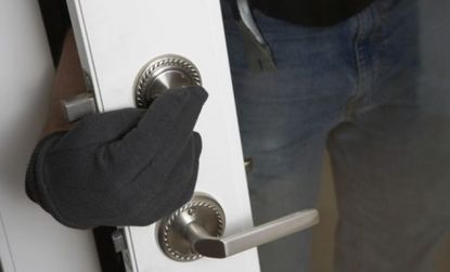 A burglar who successfully broke into an Oregon home found himself trapped by what he thought was another criminal.