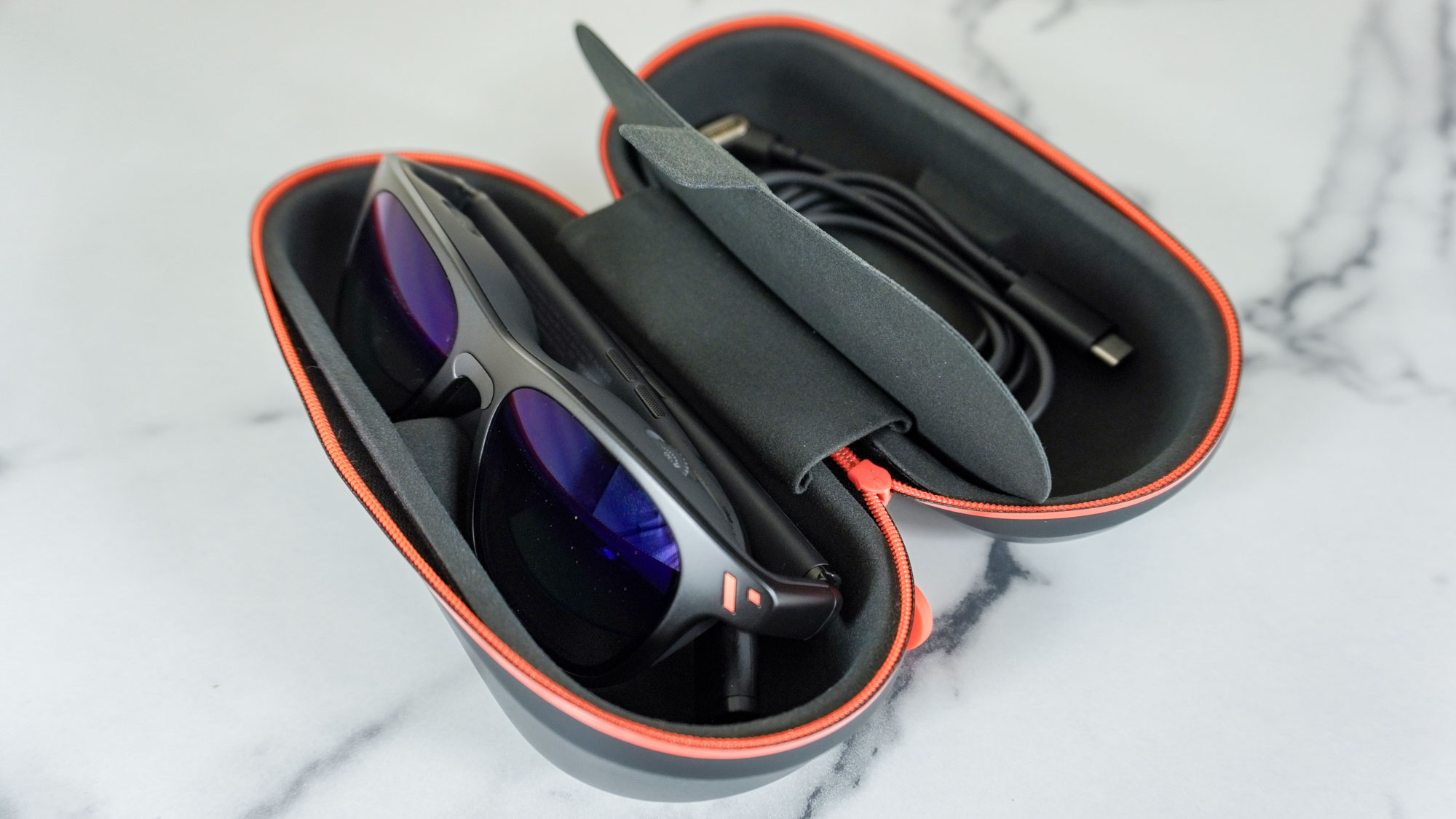The Viture Pro XR glasses in their included case on a desk