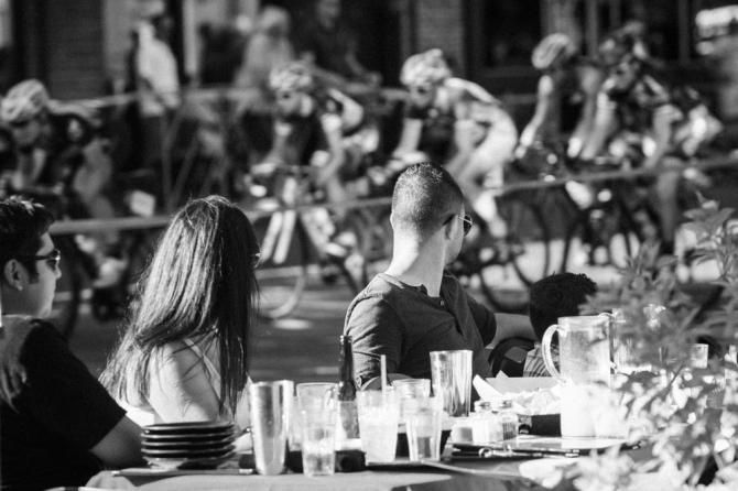 Fans watch as the women's peloton races past.