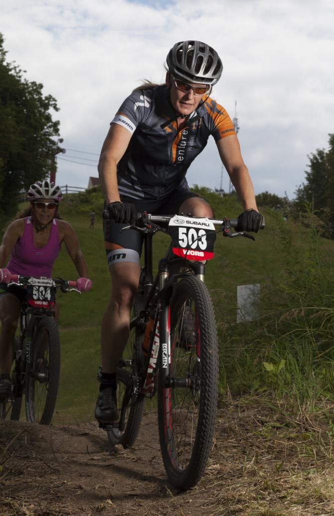 Lisa Krayer(Adventure 212/Specialized) attacks the climbs against Lori Sable (Team 65?/W
