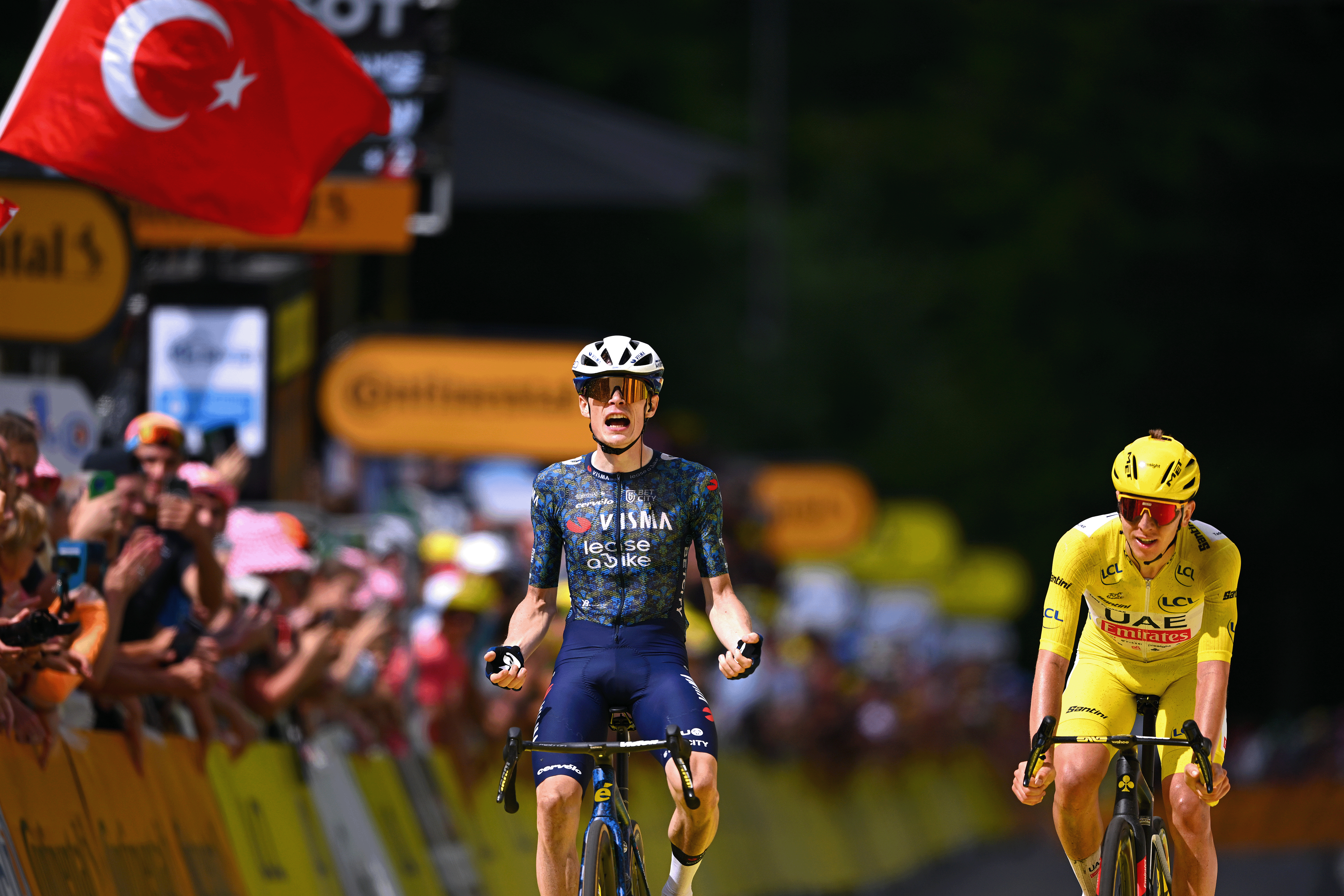 LE-LIORAN, FRANCE - JULY 10: (L-R) Jonas Vingegaard Hansen of Denmark and Team Visma | Lease a Bike celebrates at finish line as stage winner ahead of Tadej Pogacar of Slovenia and UAE Team Emirates - Yellow Leader Jersey during the 111th Tour de France 2024, Stage 11 a 211km stage from Evaux-les-Bains to Le Lioran (1239m) / #UCIWT / on July 10, 2024 in Le Lioran, France. (Photo by Dario Belingheri/Getty Images)