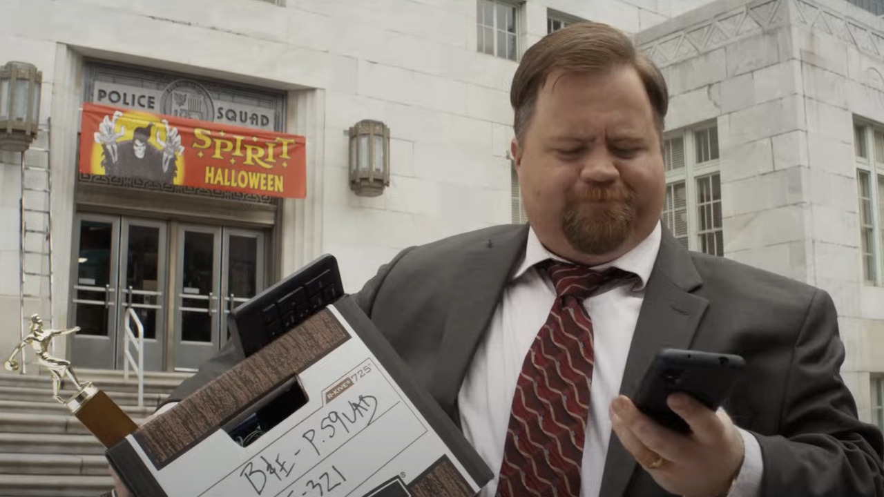Ed Jr. leaving police station with box in The Naked Gun reboot