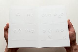 A double page spread of the braille comic