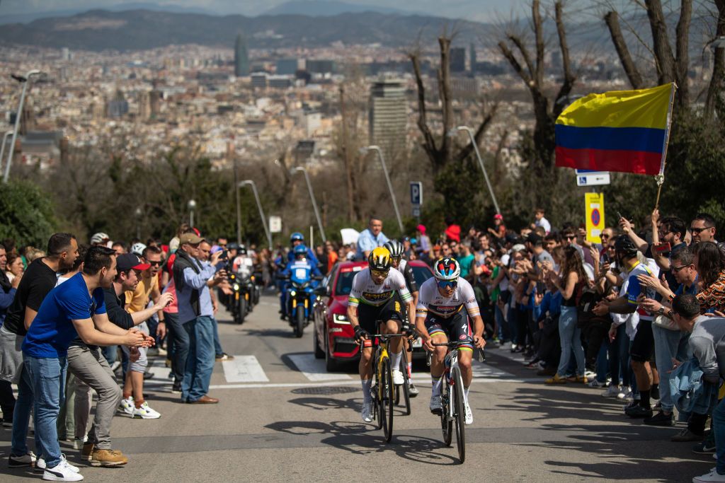 Remco Evenepoel and Primož Roglič climb through Montjuïc Park above the city of Barcelona at the 2024 Volta a Catalunya