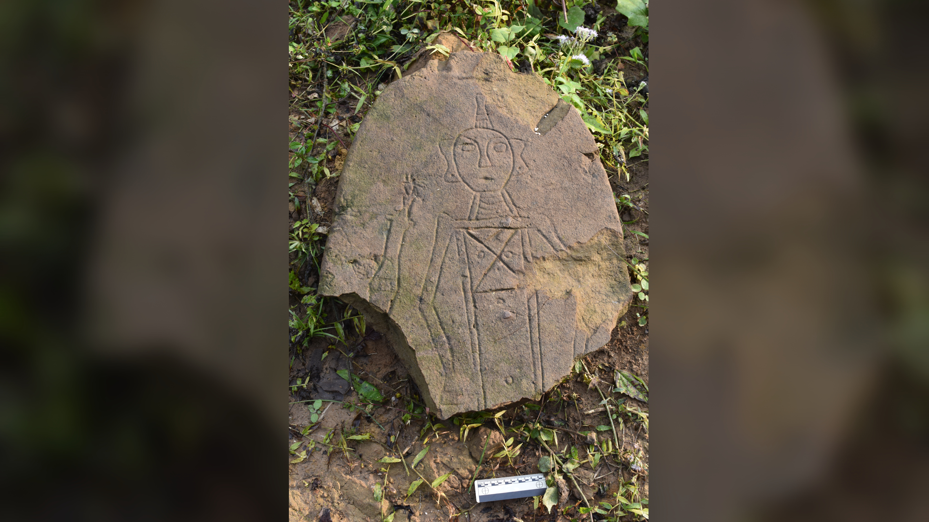 This carving on a curved stone was found at one of the stone jar sites. Although some of the jars are carved with geometric designs, carved portraits like this have been found nowhere else.