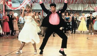 Grease Olivia Newton-John and John Travolta bust some moves at the school dance