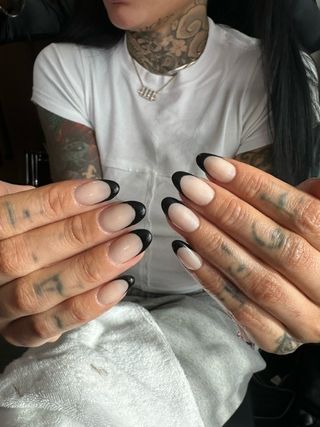 Kehlani wearing the black French nail trend