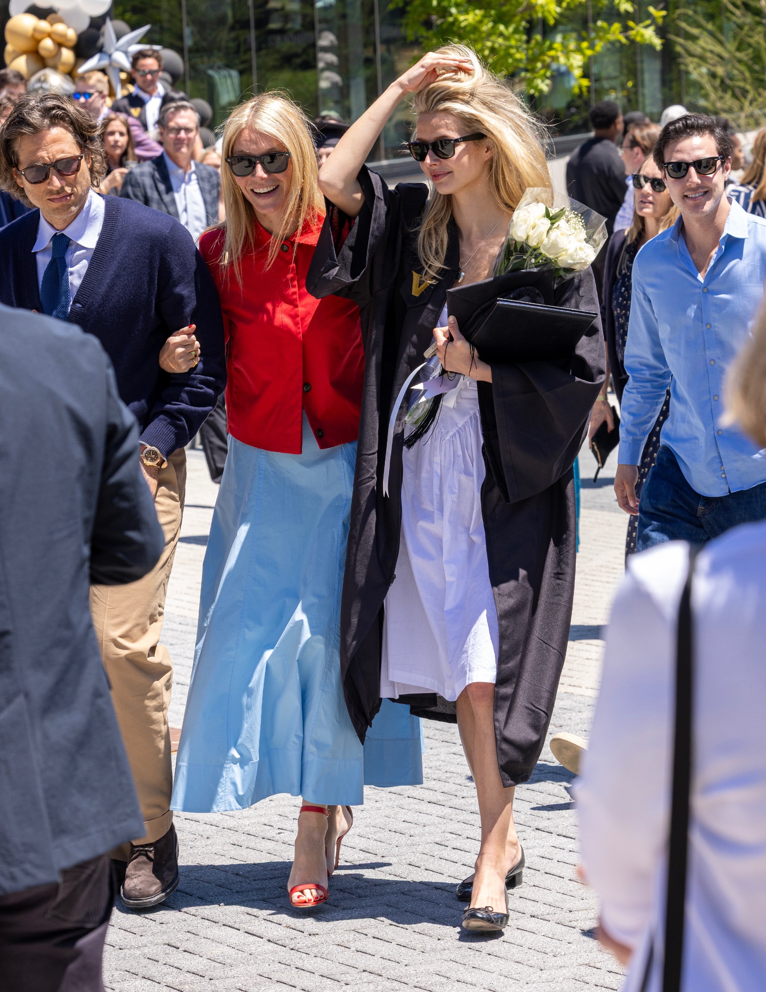 Gwyneth Paltrow wearing blue dress and red jacket on 08/05/2026 in Nashville