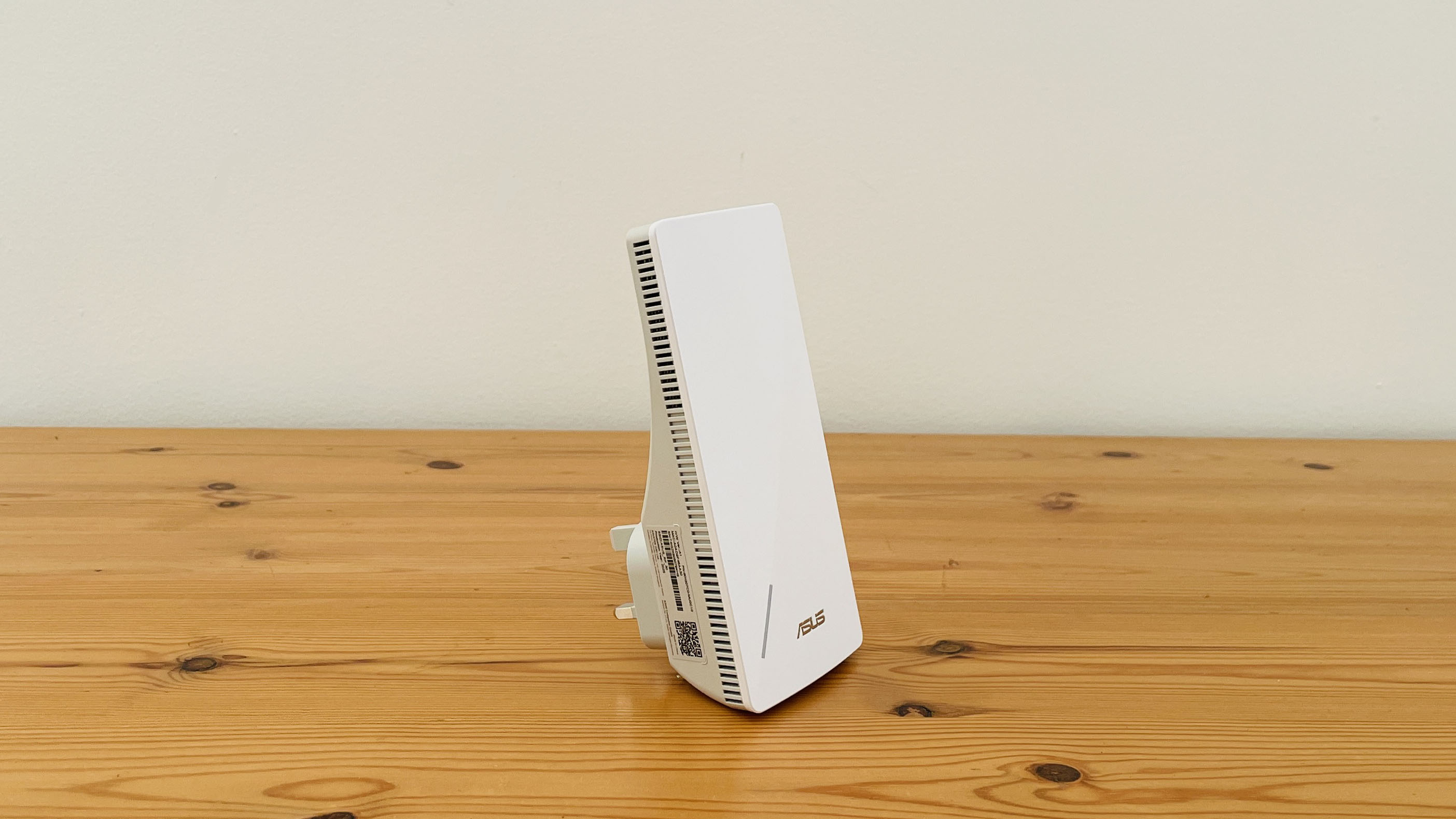 Asus RP-AX58 on a wooden table