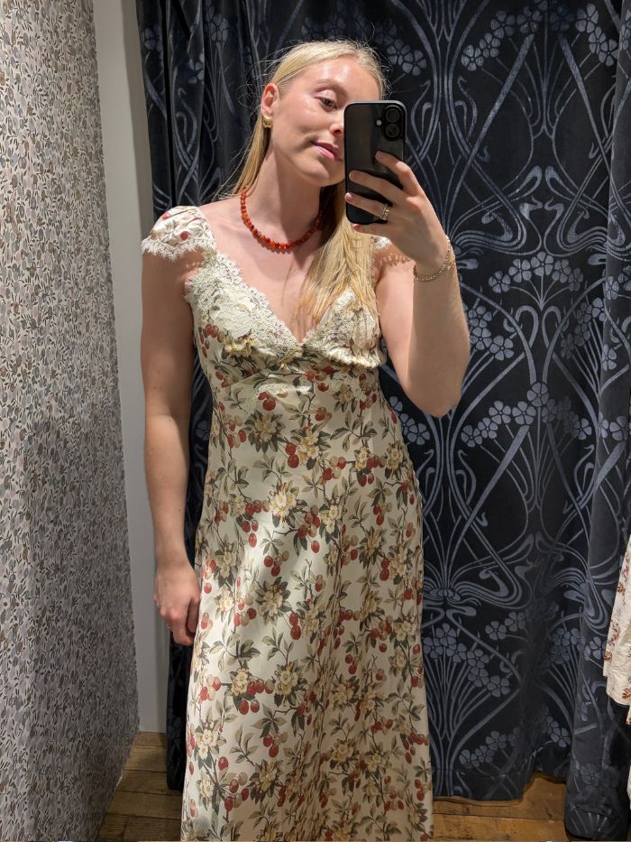 Woman wears floral dress with lace