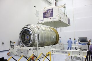 Orbital ATK's next Cygnus cargo ship to fly, called OA-4, is seen at NASA's Kennedy Space Center in Florida after arriving for processing in August.