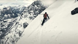 Kilian Jornet and David Lindgren skiing on a steep climbing route in Norway