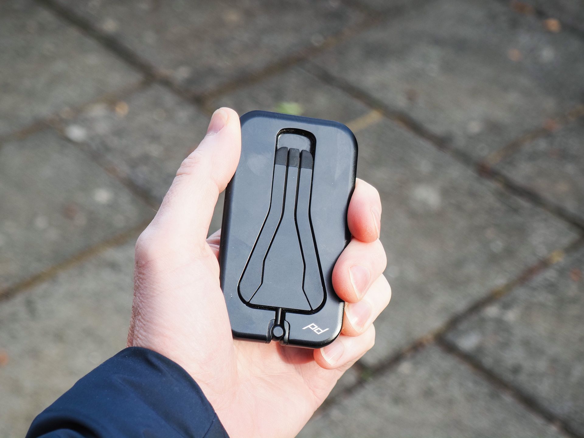 Peak Design Mobile Tripod folded away, in user's hand
