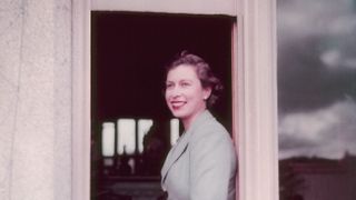 Queen Elizabeth II sitting in the window at Balmoral Castle in Scotland on 9 September 1952