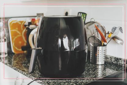 An air fryer on a kitchen counter