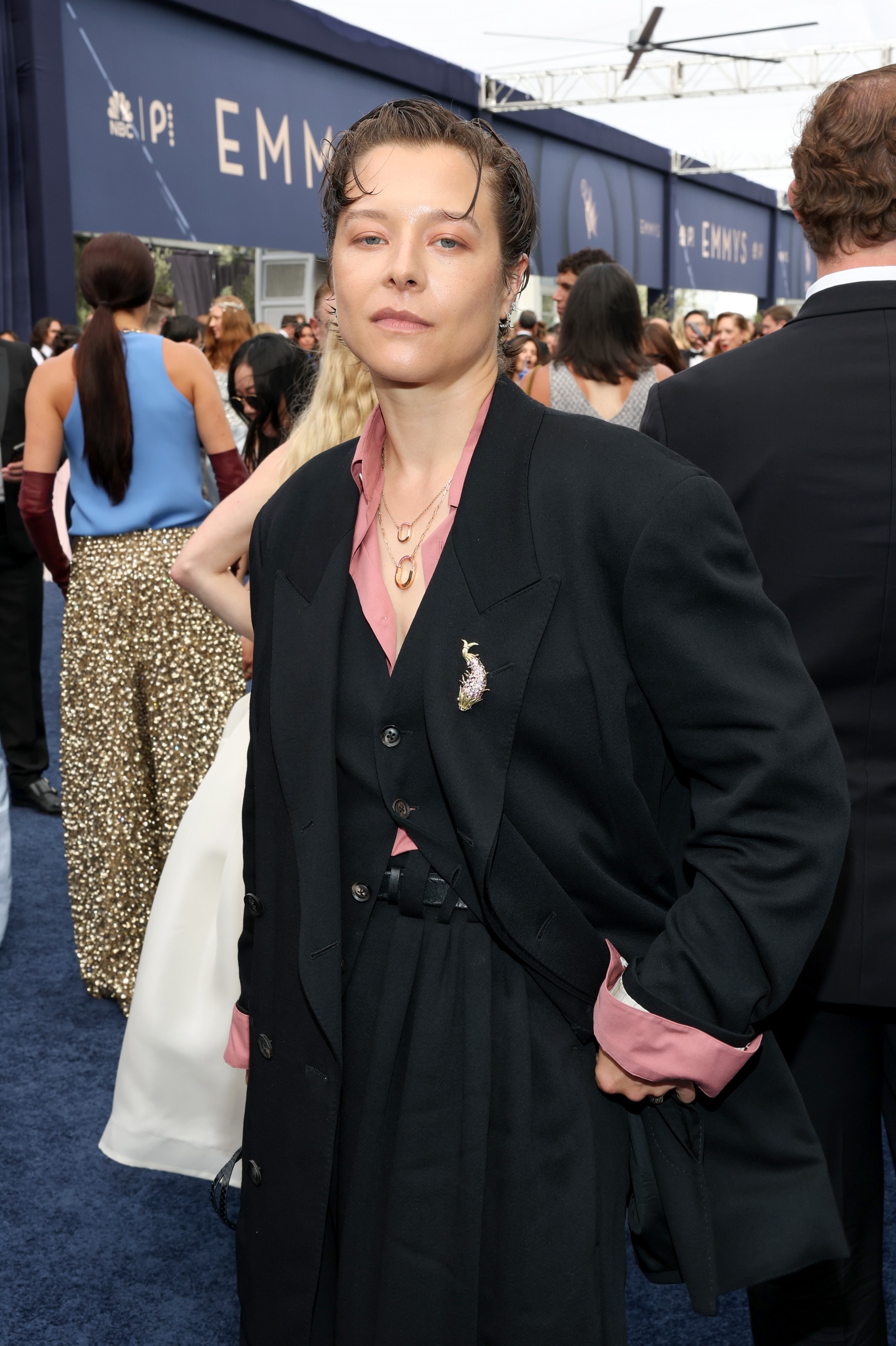 a white woman with short hair in a black suit