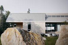 view of East River Residence, a delicate Nova Scotia house made of glazing and timber and open to rugged landscape vistas