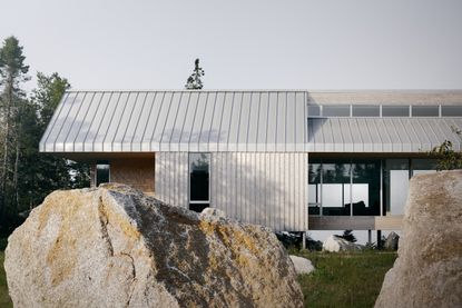 view of East River Residence, a delicate Nova Scotia house made of glazing and timber and open to rugged landscape vistas