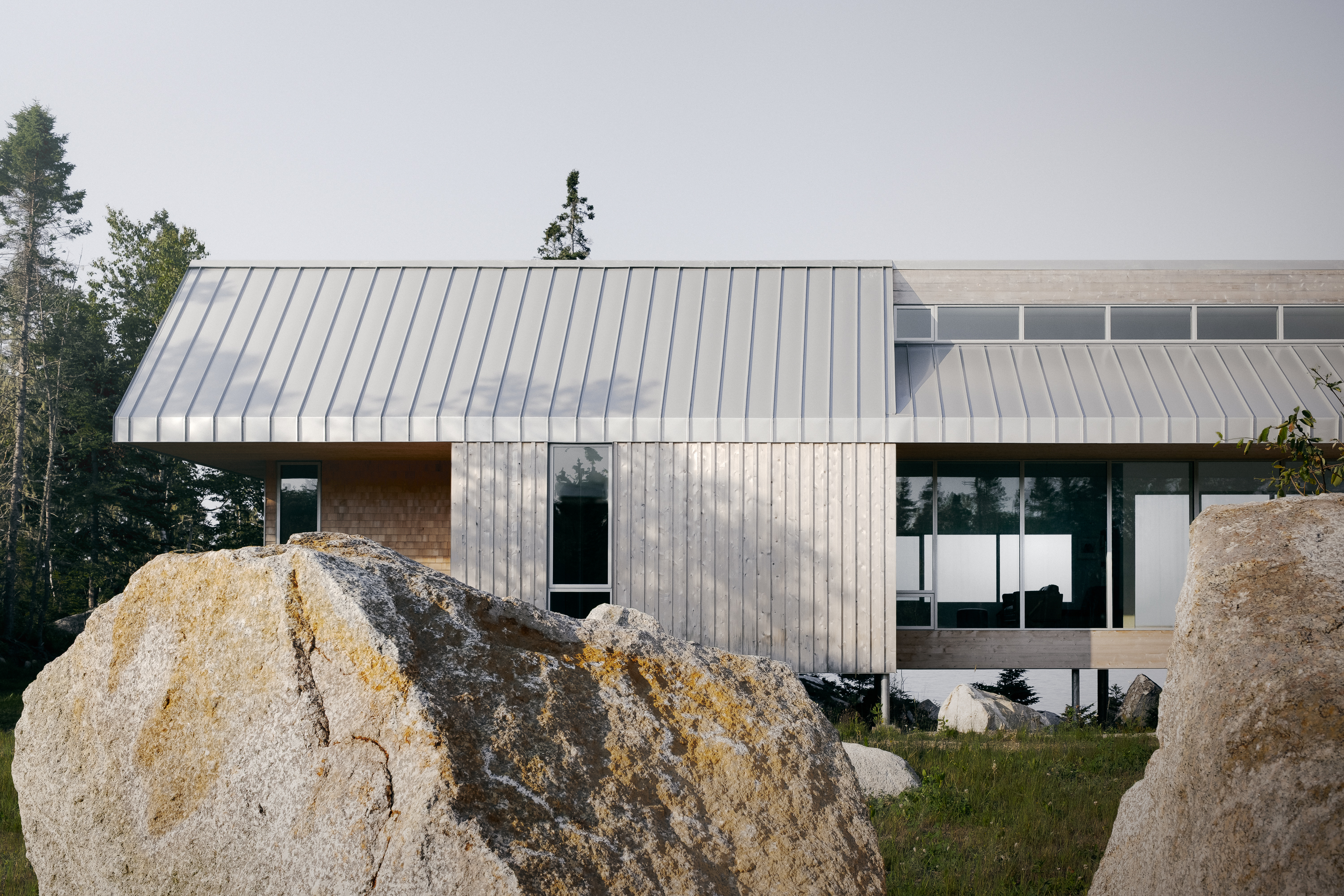 view of East River Residence, a delicate Nova Scotia house made of glazing and timber and open to rugged landscape vistas