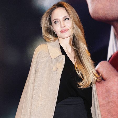 Angelina Jolie wearing a camel coat